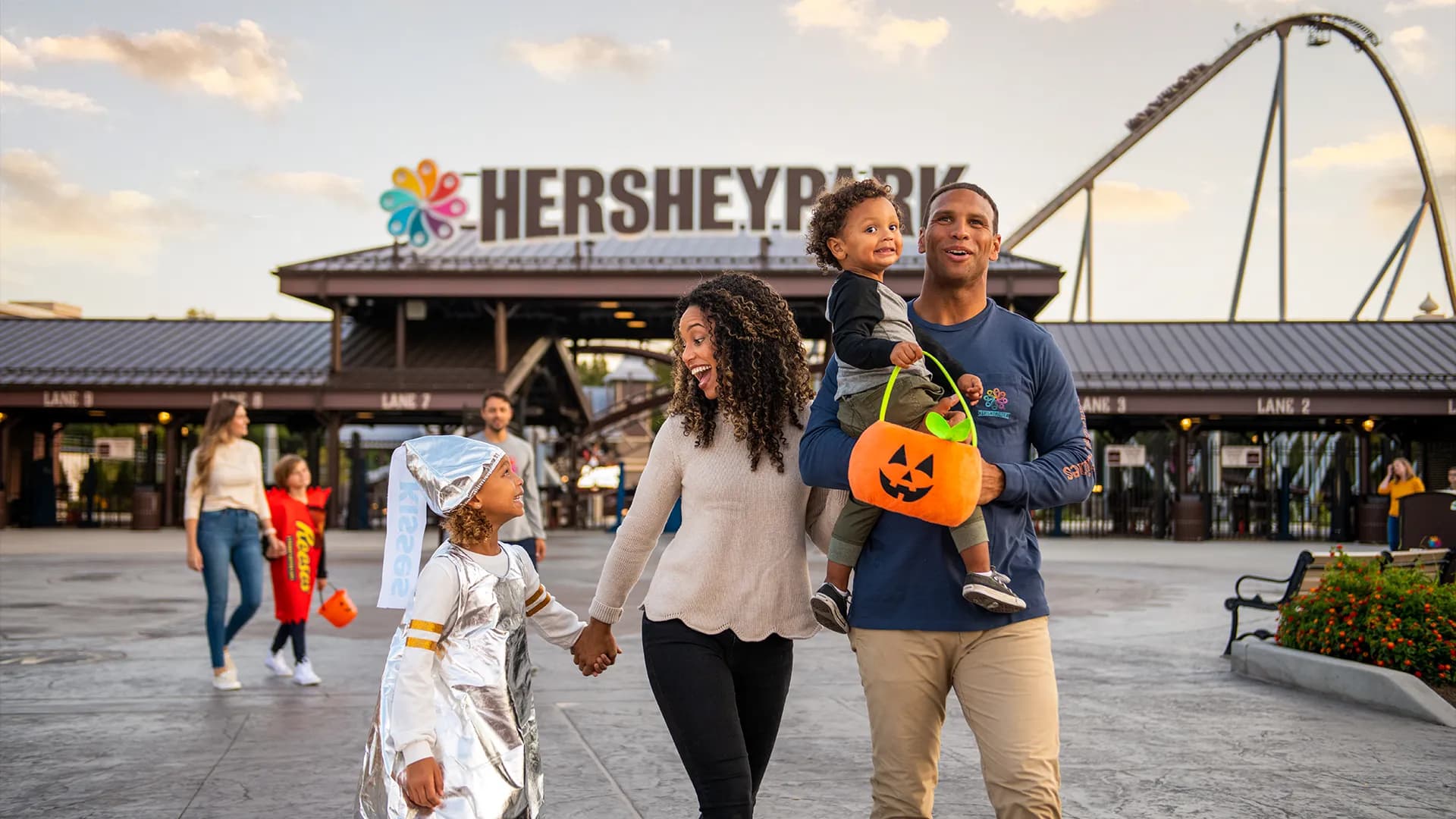 family at the front gates during hersheypark halloween