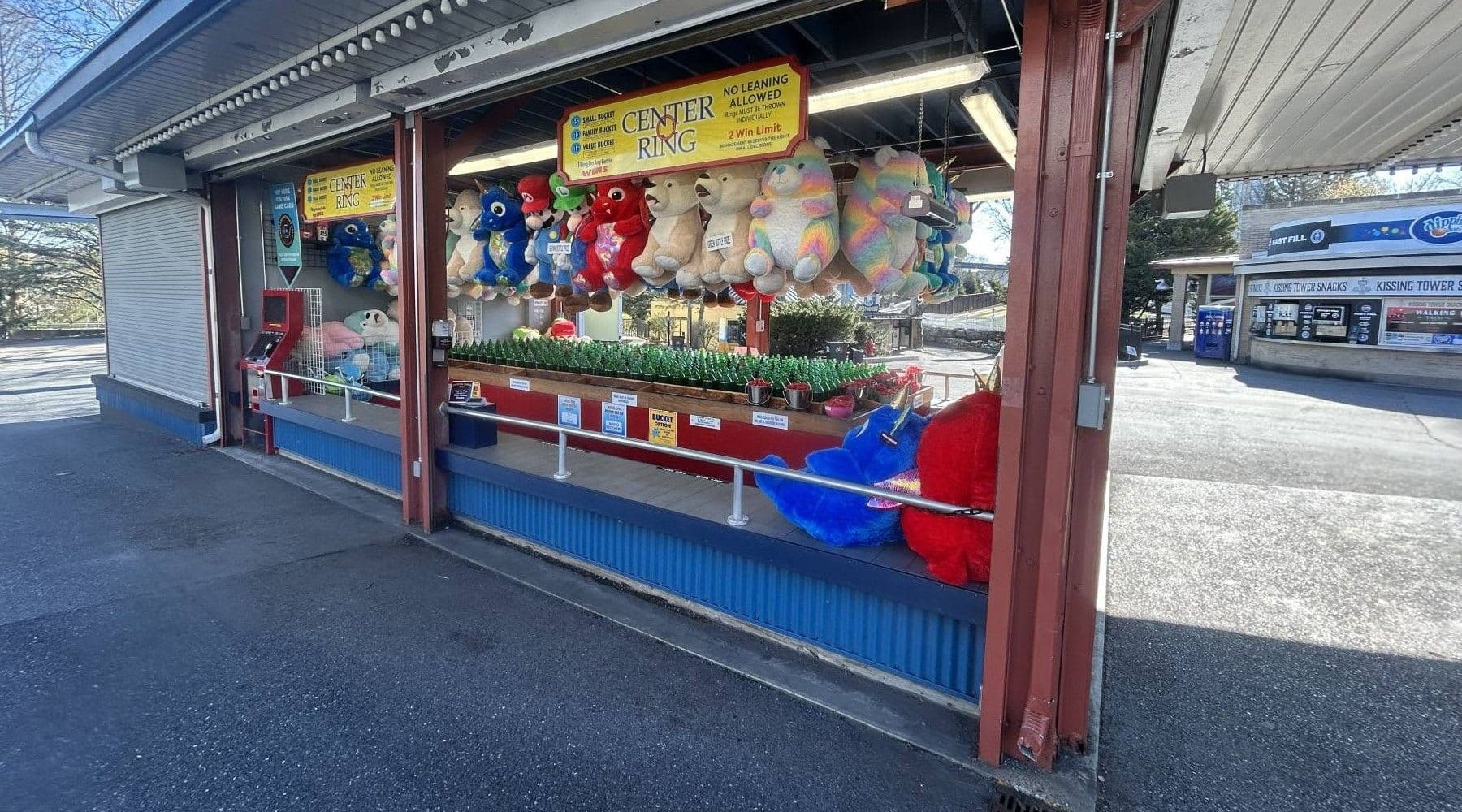 Players throw a ring on a bottle to win a prize