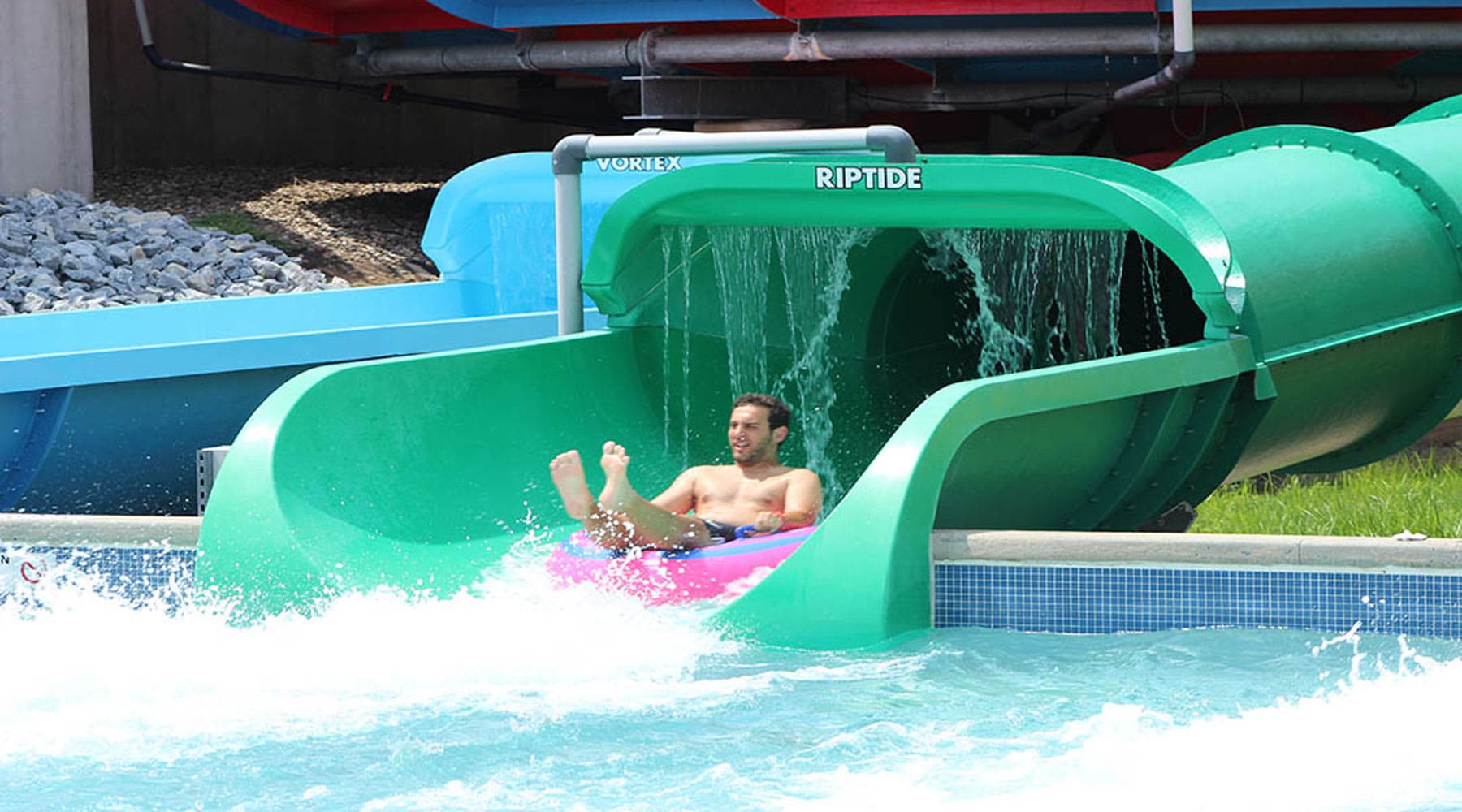 Man riding Coastline Plunge Riptide water slide