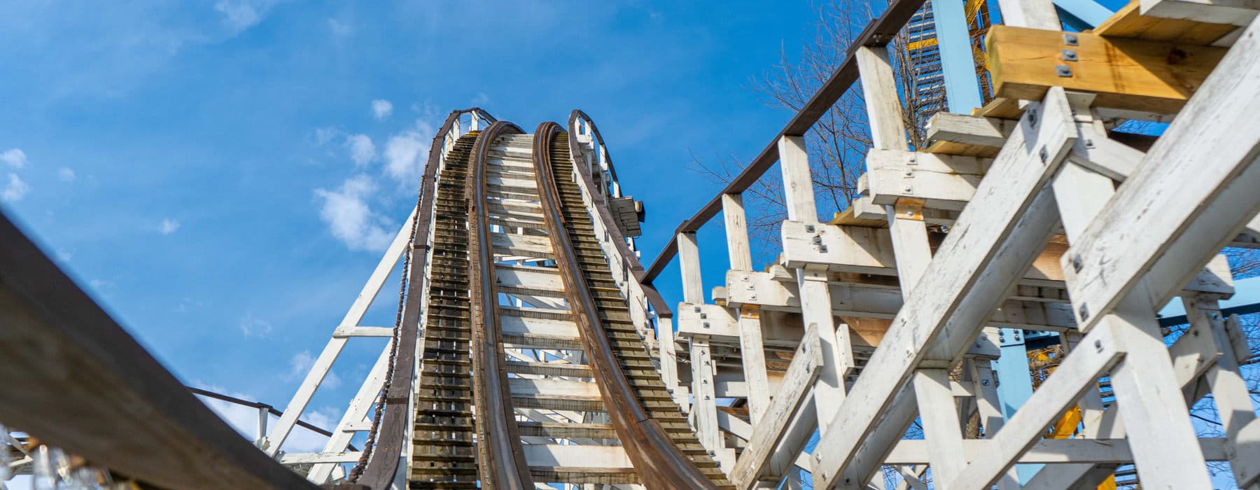 People riding The Comet Wooden Rollercoaster