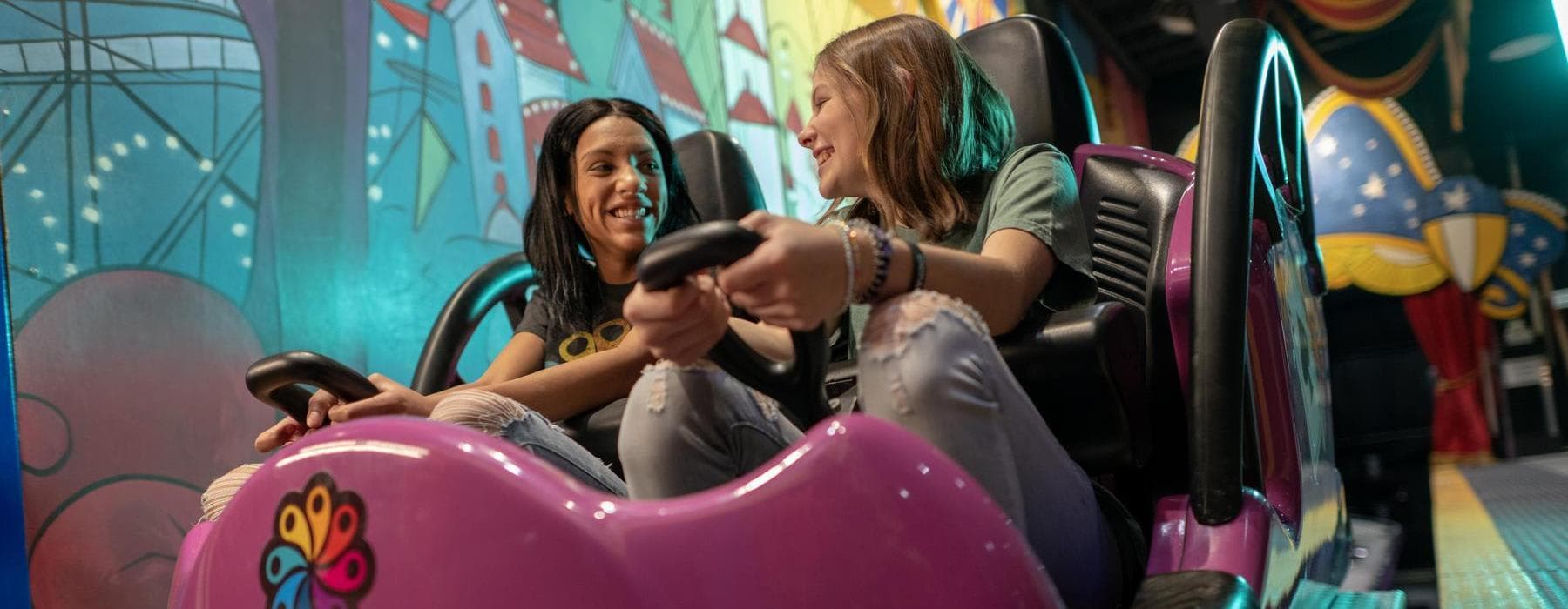 Two girls on Laff Trakk