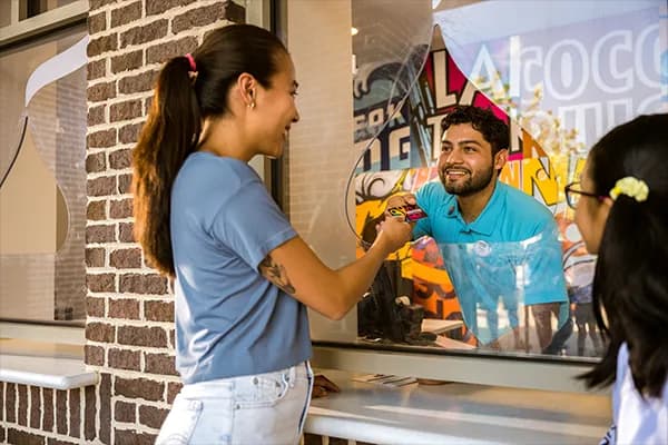 hersheypark employee handing season pass card to guest