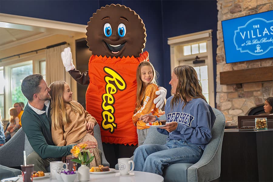 family with reese character at the villas at the hotel hershey