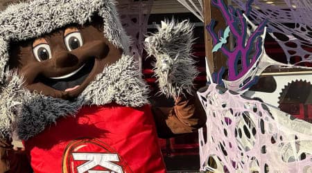 Kit Kat Character at Hersheypark posing for photo with family