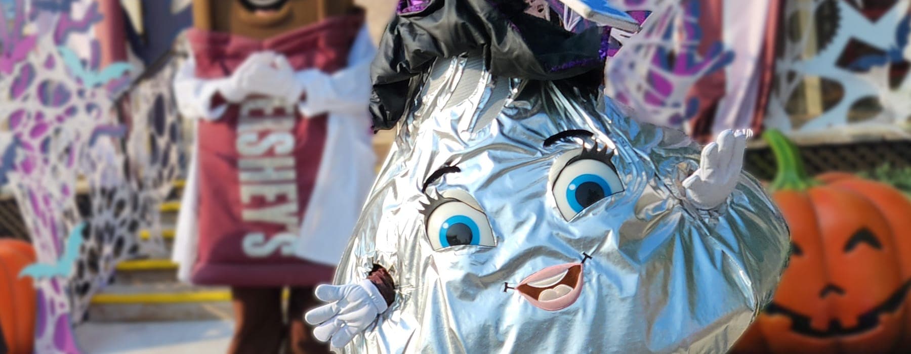 Hershey's Kiss Character at Hersheypark celebrating with happy children