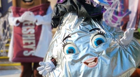 Hershey's Kiss Character at Hersheypark celebrating with happy children