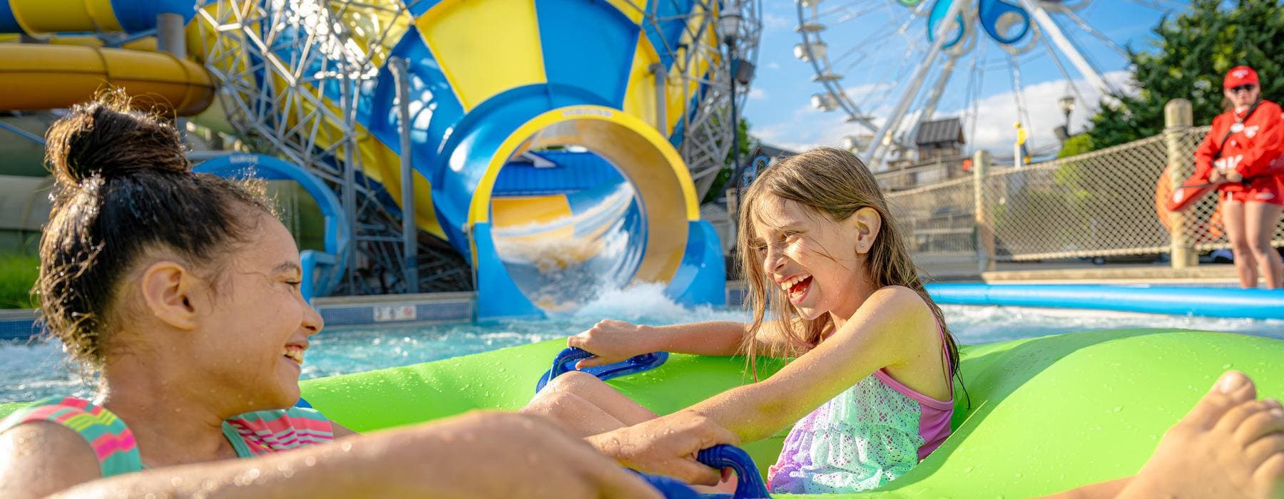 girls riding Coastline Plunge Whirlwind water attraction at Hersheypark